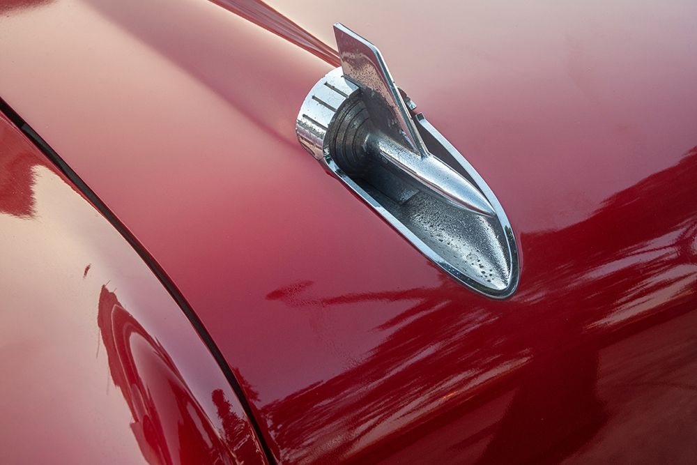 Detail of hood ornament of red 57 Chevrolet Bel Air in Habana-Havana-Cuba